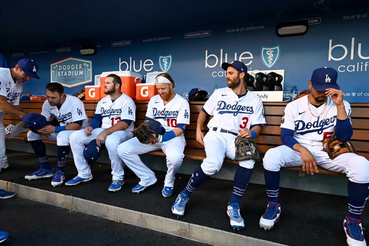 This picture shows members of the Los Angeles Angels sitting on the bench in the dugout.